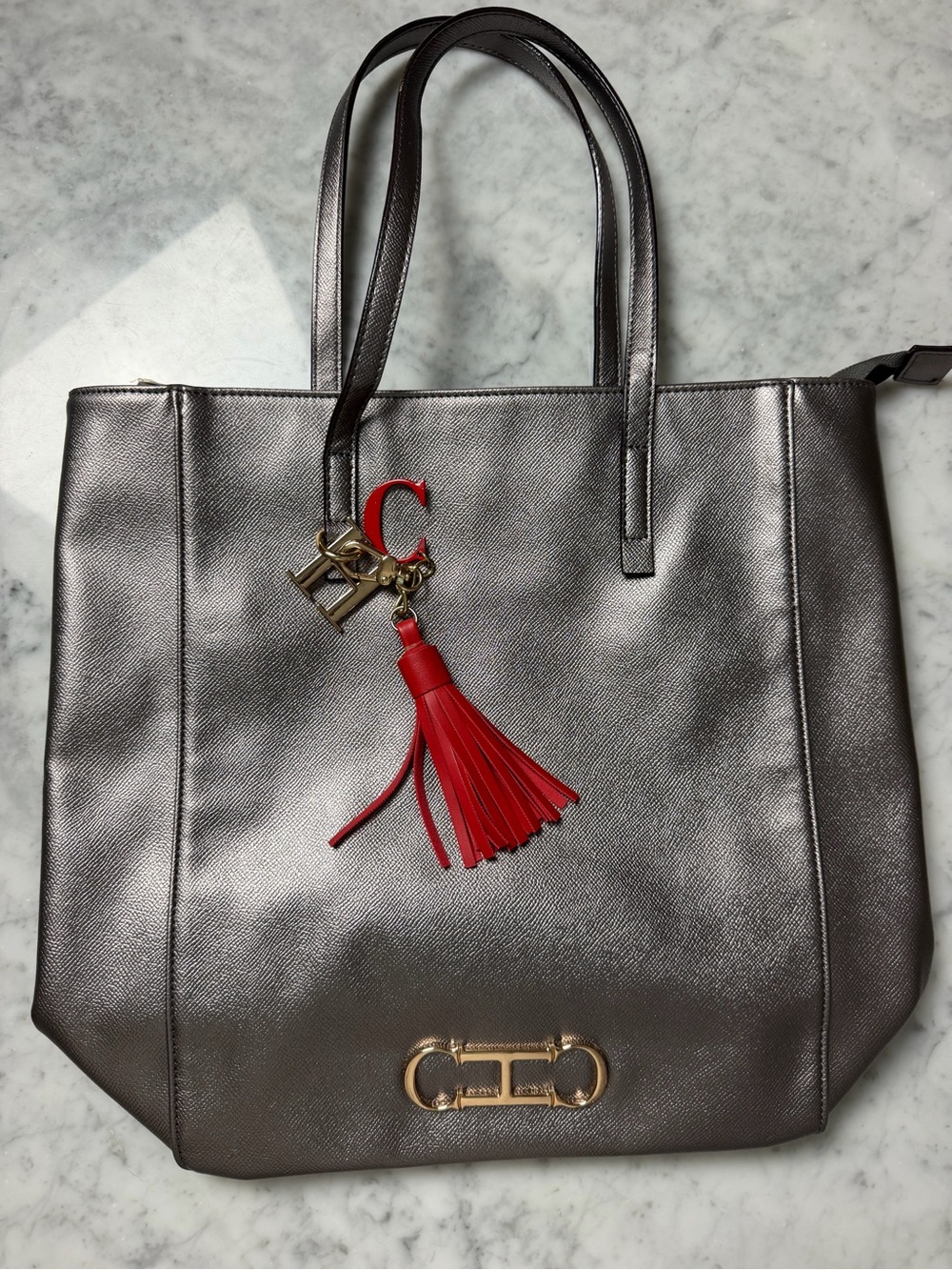 Carolina Herrera Metallic Gray Tote with Red Tassel Charm